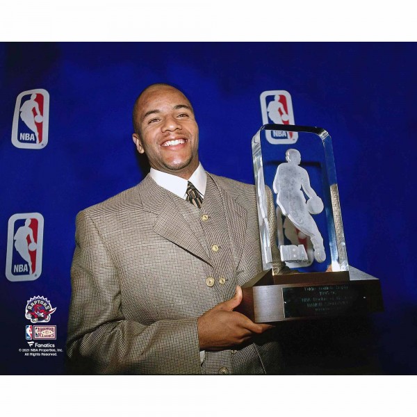 Unsigned Toronto Raptors Damon Stoudamire Fanatics Authentic Holding 1995-96 NBA Rookie of the Year Trophy Photograph